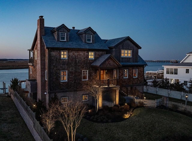 view of front of home featuring a water view