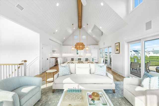 102 102nd St, Stone Harbor, NJ 08247 - living room with high vaulted ceiling, light wood finished floors, beamed ceiling, recessed lighting, and a chandelier