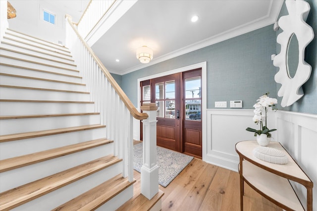 102 102nd St, Stone Harbor, NJ 08247 - entryway featuring stairs, crown molding, light wood-type flooring, a wainscoted wall, and recessed lighting