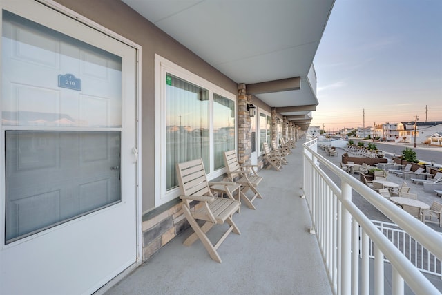 view of balcony at dusk