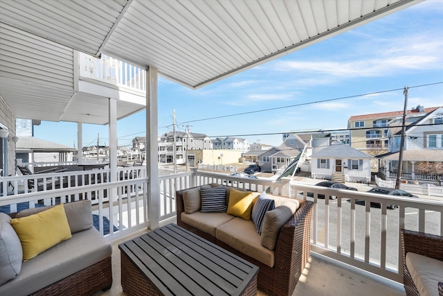 balcony featuring a residential view and an outdoor hangout area