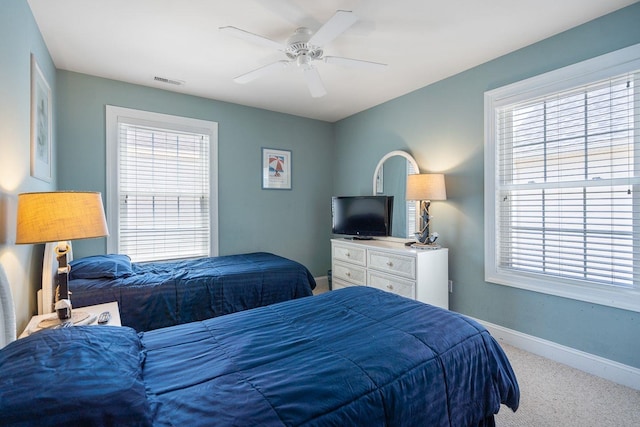 carpeted bedroom featuring ceiling fan