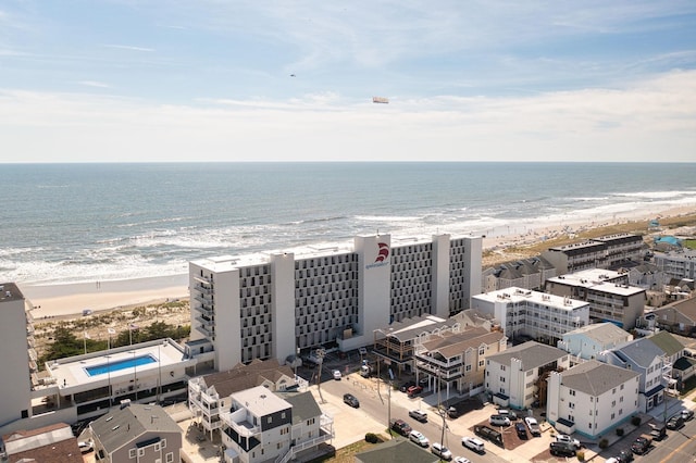 bird's eye view featuring a view of the beach and a water view