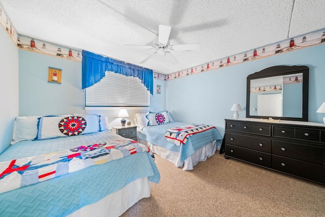 carpeted bedroom featuring ceiling fan and a textured ceiling