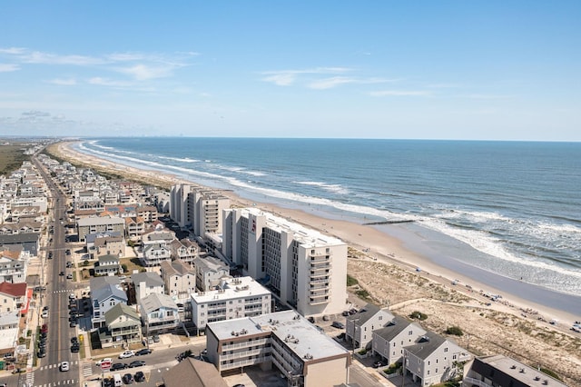 birds eye view of property featuring a water view and a view of the beach