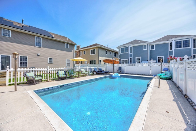 view of swimming pool featuring a patio area