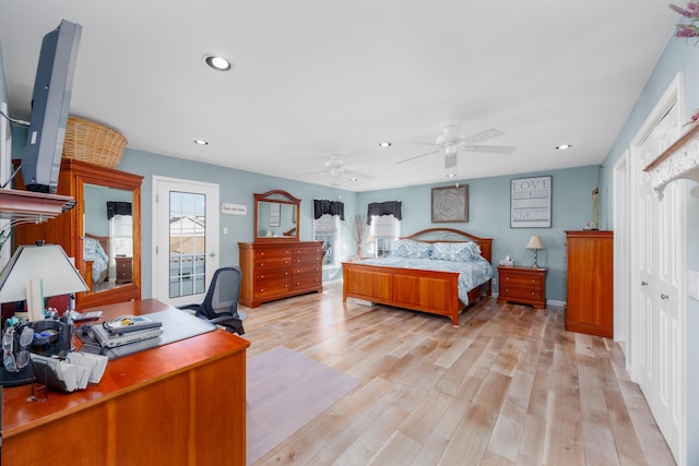 bedroom featuring access to outside, light hardwood / wood-style floors, and ceiling fan