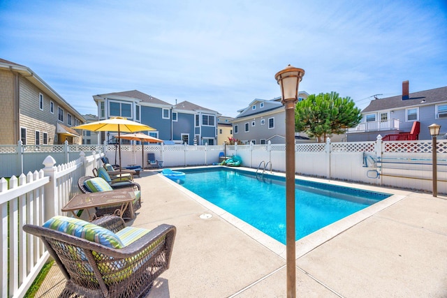 view of pool featuring a patio