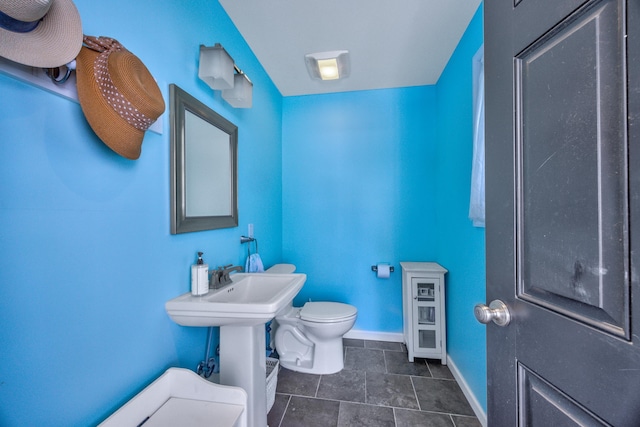 bathroom with tile patterned floors and toilet