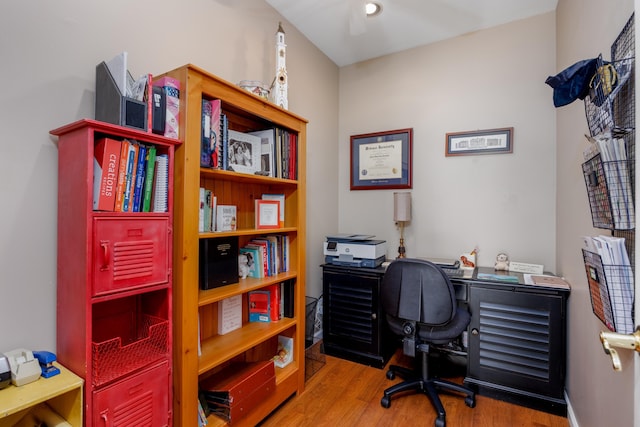 office with ceiling fan and light hardwood / wood-style flooring