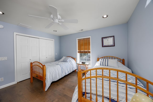 bedroom featuring ceiling fan, a closet, and dark hardwood / wood-style floors