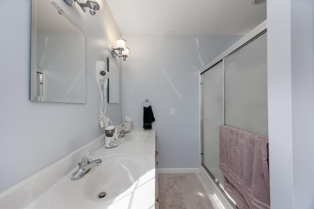 bathroom with vanity and an enclosed shower