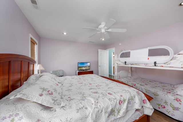 bedroom featuring hardwood / wood-style flooring and ceiling fan