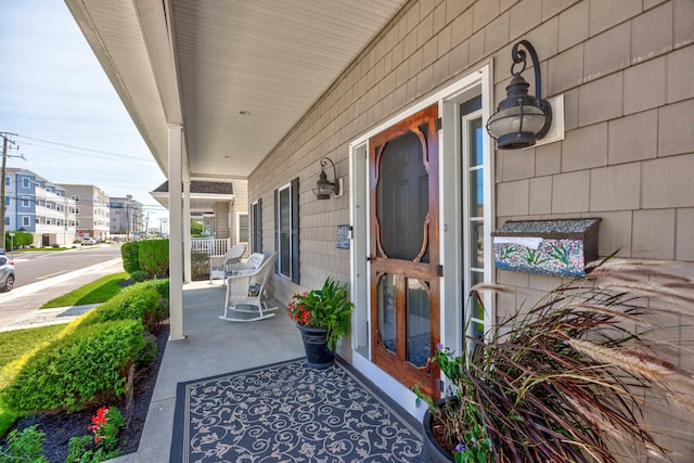 entrance to property featuring a porch