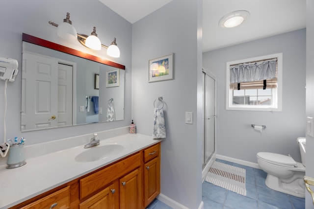 bathroom with toilet, vanity, tile patterned floors, and an enclosed shower