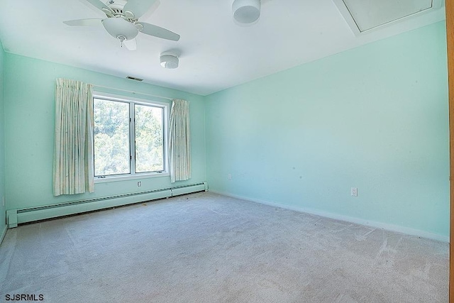 carpeted empty room featuring baseboard heating and ceiling fan