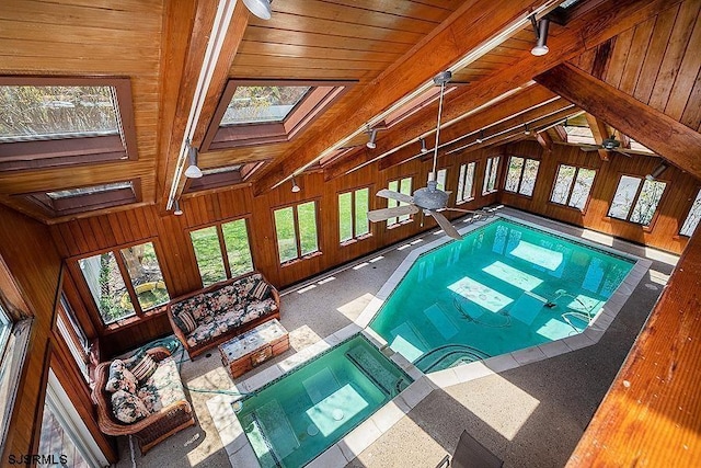 view of pool featuring a skylight and ceiling fan