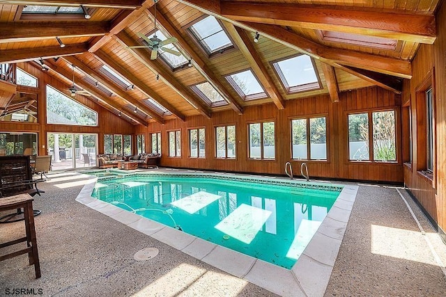 view of swimming pool featuring a skylight