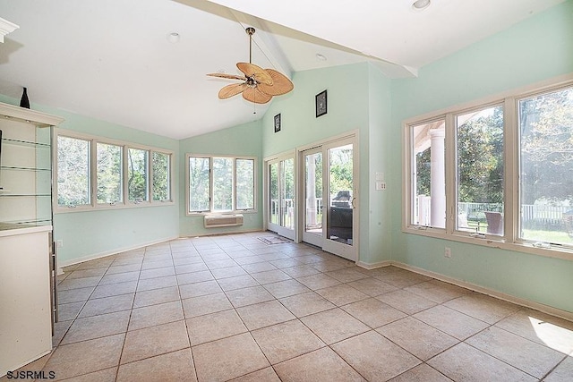 unfurnished sunroom featuring ceiling fan, lofted ceiling, and a wall mounted AC