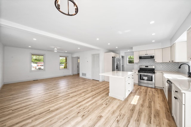 192 Rte 47 S, Cape May Court House, NJ 08210 - kitchen featuring appliances with stainless steel finishes, a sink, light countertops, tasteful backsplash, and recessed lighting