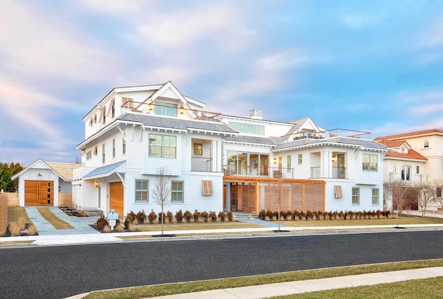 view of front of house with a balcony and a garage