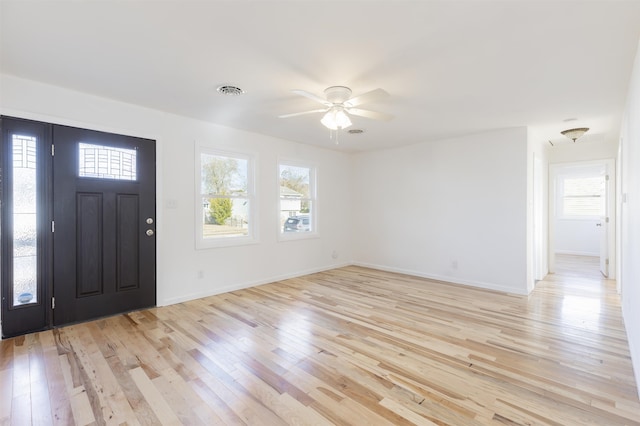 foyer entrance with light hardwood / wood-style flooring and ceiling fan