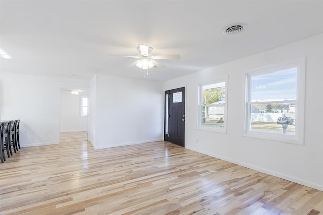 foyer featuring ceiling fan and light wood-type flooring