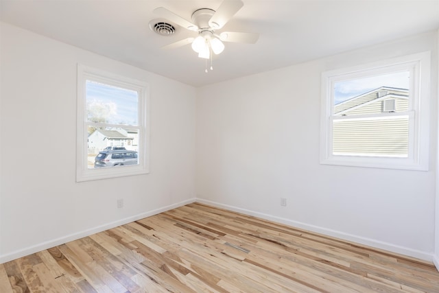 spare room featuring ceiling fan and light hardwood / wood-style floors