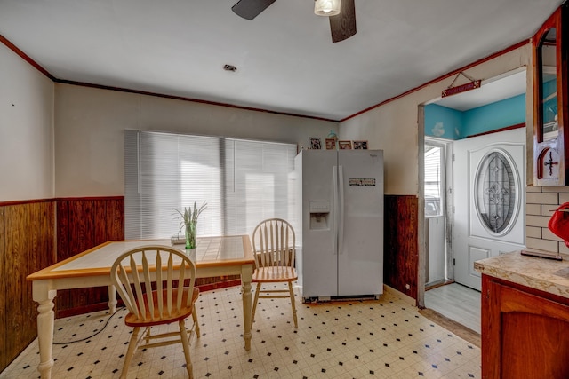 dining space featuring crown molding and ceiling fan