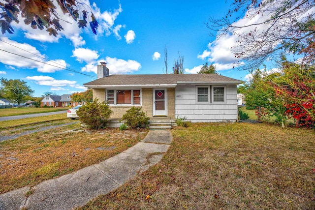 view of front of home with a front yard