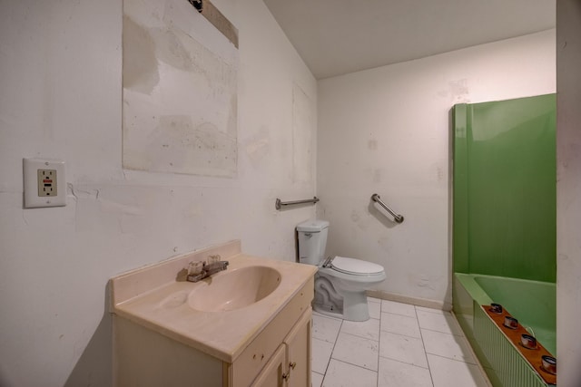 bathroom with a tub to relax in, vanity, toilet, and tile patterned flooring