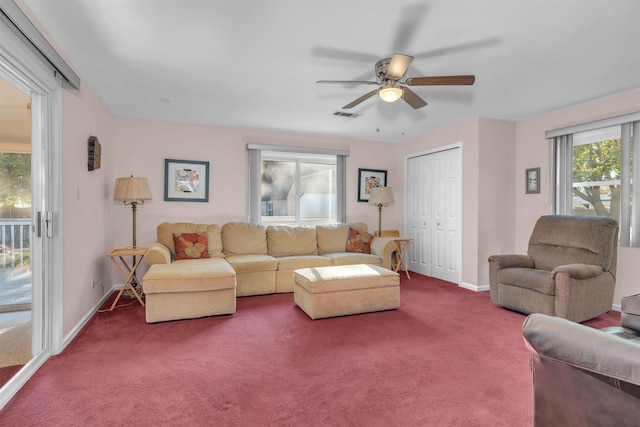 living room featuring ceiling fan and carpet floors