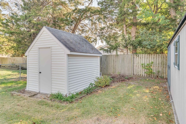 view of outdoor structure featuring a lawn