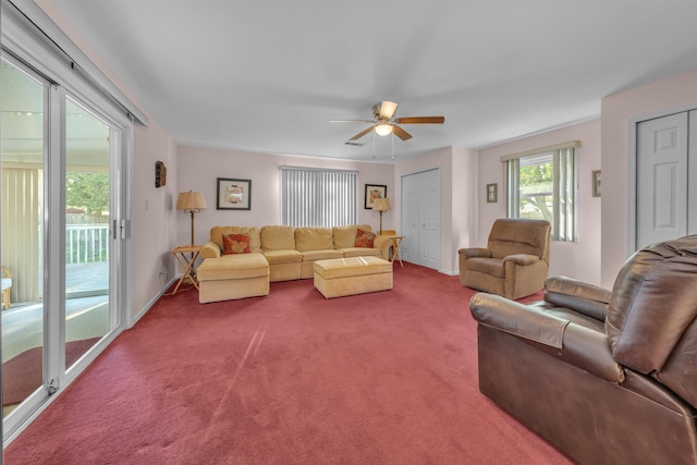 carpeted living room featuring ceiling fan