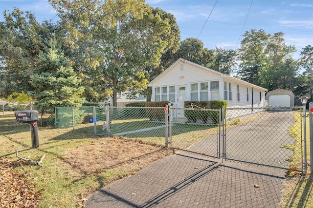 view of front of property featuring a front yard and a garage