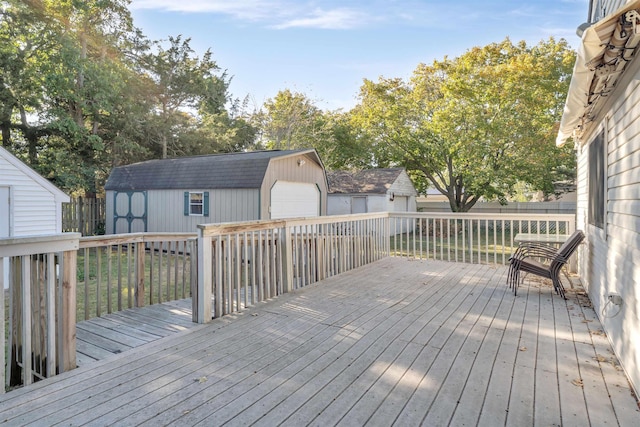 wooden terrace featuring a storage shed