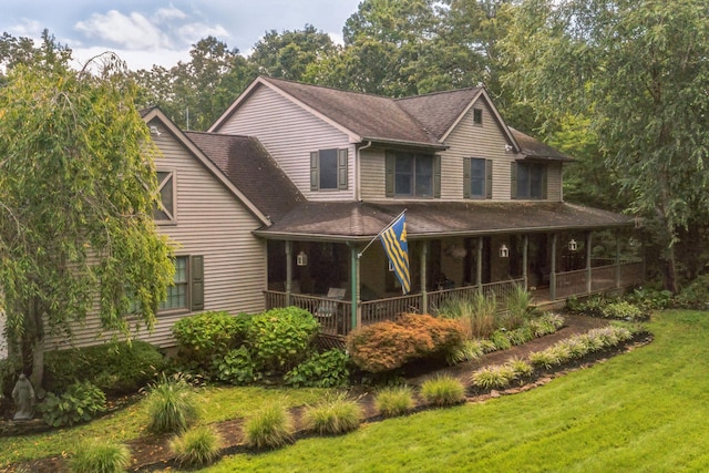 view of front of property with a front lawn and a porch