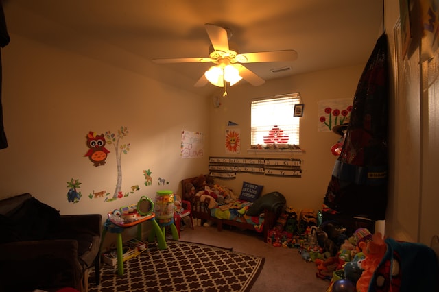 game room with ceiling fan and carpet floors