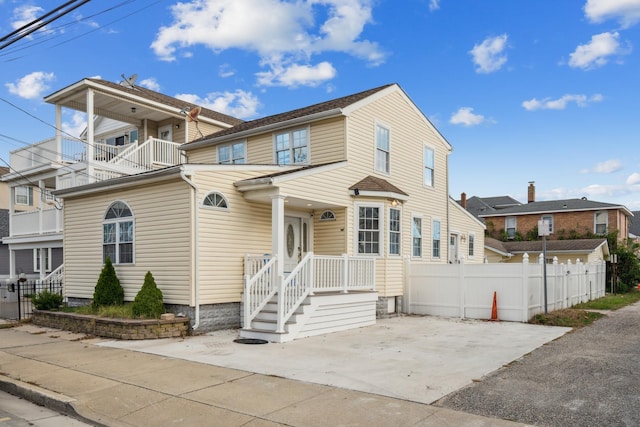 view of front of property with a balcony