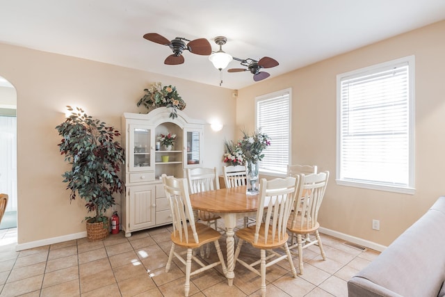 dining room with ceiling fan and light tile patterned floors