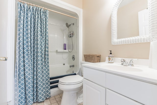 full bathroom featuring shower / bath combo with shower curtain, tile patterned flooring, vanity, and toilet