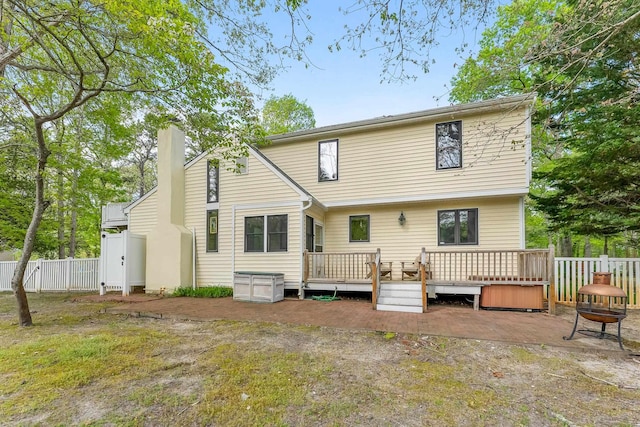 57 Somers Ave, Seaville, NJ 08230 - rear view of house with fence, a wooden deck, and a chimney