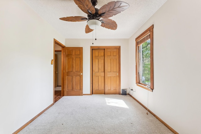 57 Somers Ave, Seaville, NJ 08230 - unfurnished bedroom featuring carpet, baseboards, a closet, a textured ceiling, and a ceiling fan