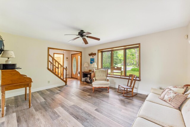 57 Somers Ave, Seaville, NJ 08230 - living area with stairway, light wood finished floors, ceiling fan, and baseboards