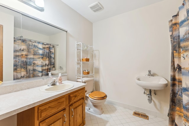 57 Somers Ave, Seaville, NJ 08230 - bathroom featuring a sink, tile patterned flooring, toilet, and baseboards