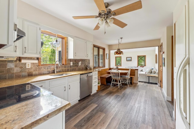 57 Somers Ave, Seaville, NJ 08230 - kitchen with dishwasher, a sink, decorative backsplash, and white cabinets
