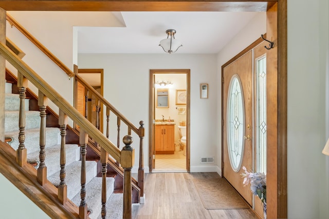 57 Somers Ave, Seaville, NJ 08230 - foyer with light wood finished floors, stairway, and baseboards