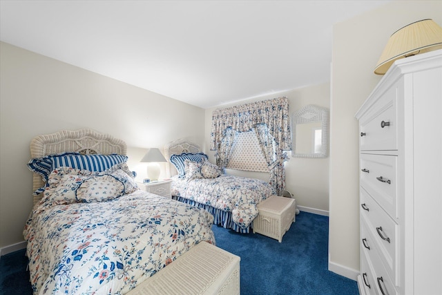 bedroom featuring dark carpet