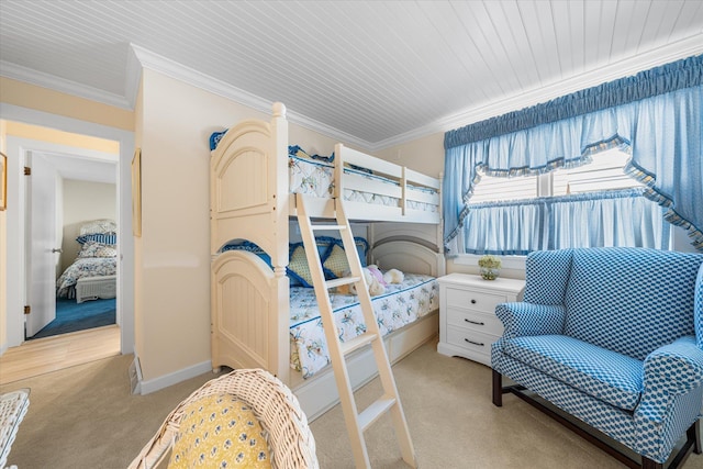 carpeted bedroom featuring wood ceiling and ornamental molding