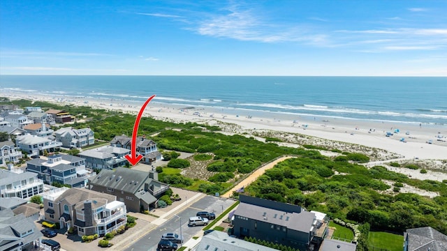 drone / aerial view with a view of the beach and a water view